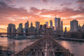 New York City skyline at golden hour with Brooklyn Bridge
